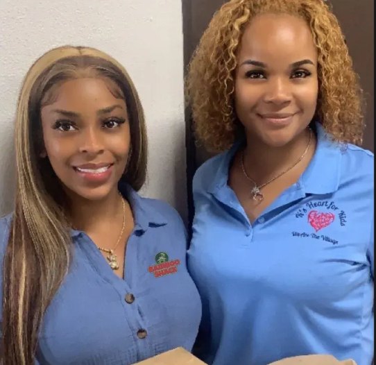 Two nurses in blue uniforms during the Bamboo Shack Nurses Month give-back